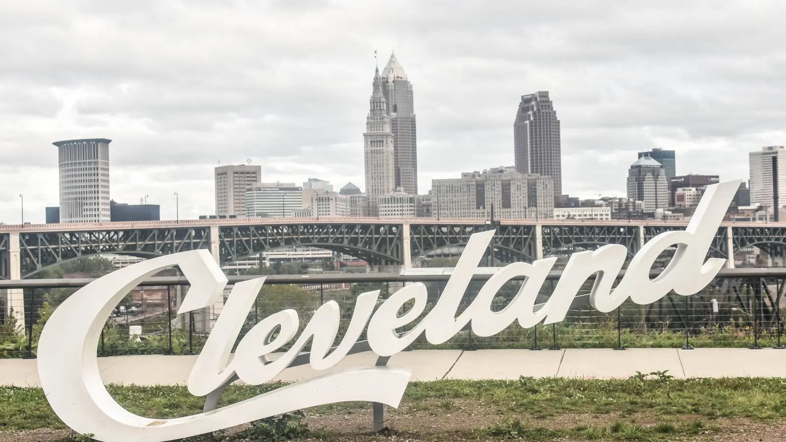 The Cleveland script sign in front of the downtown skyline and Terminal Tower.