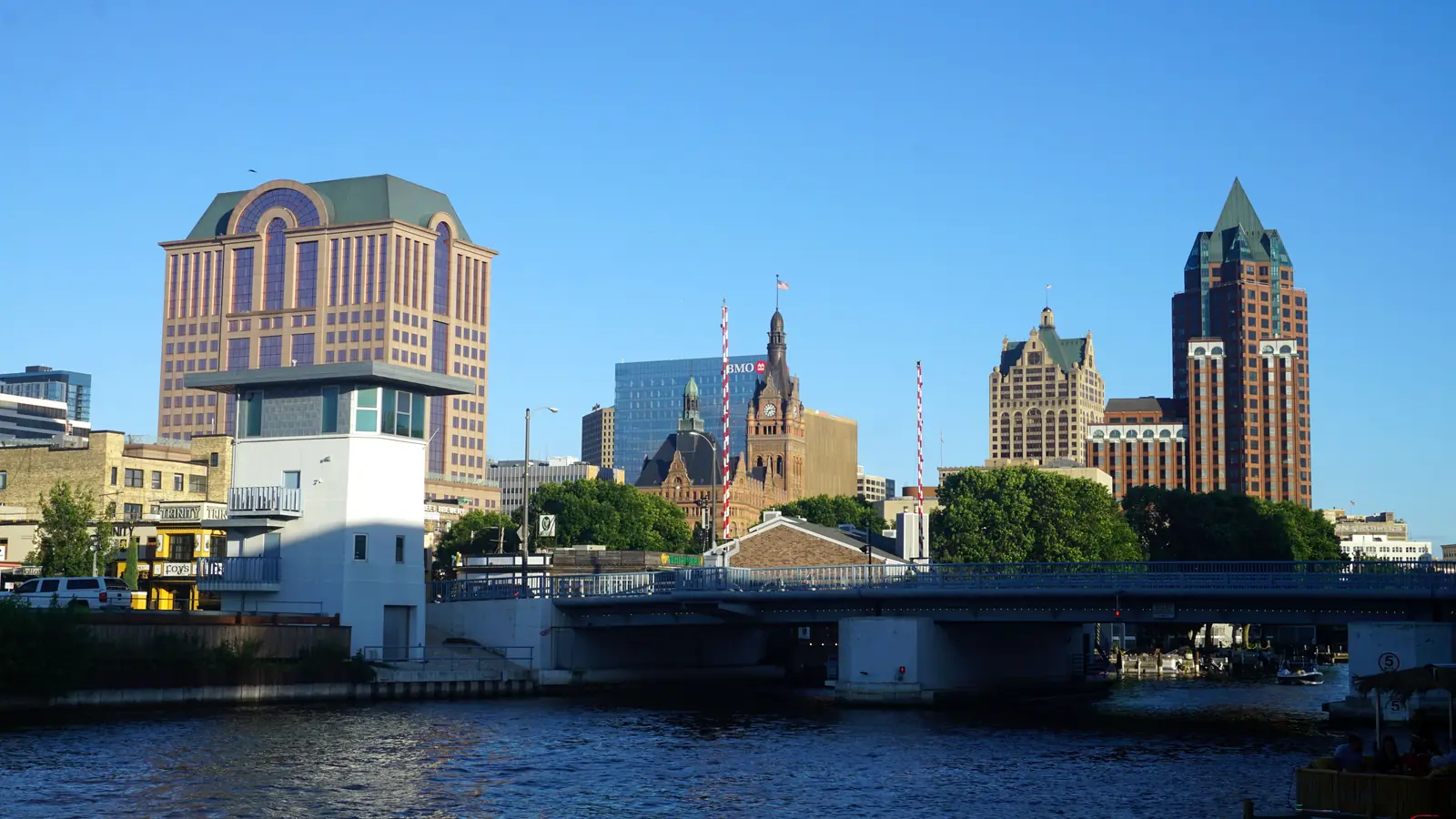 Downtown Milwaukee towers above the Milwaukee River on a sunny June day.