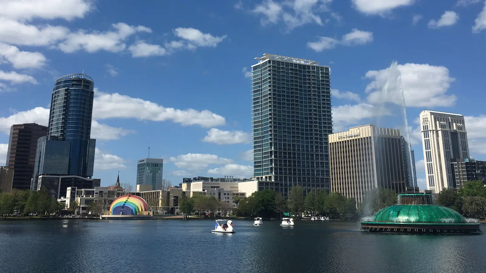 Downtown Orlando towers and the Lake Eola fountain across the lake.