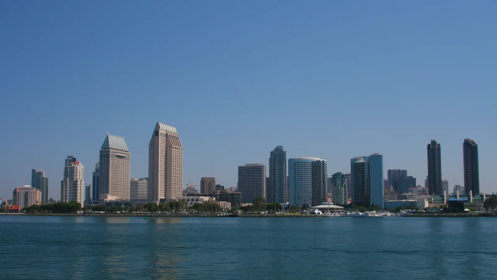 The San Diego skyline across the blue water of San Diego Bay.
