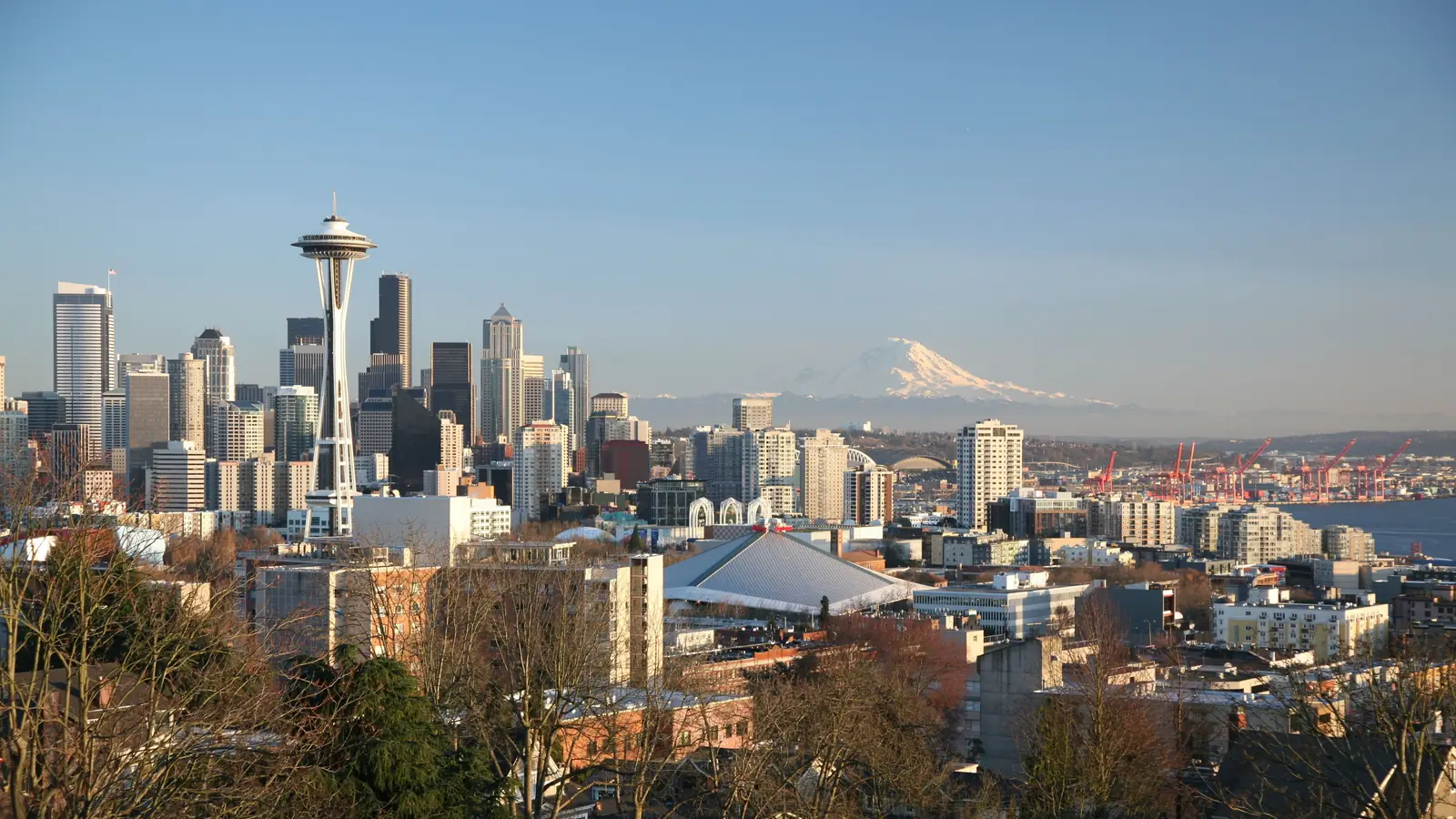 The Seattle skyline and Space Needle from Queen Anne Hill, with Mount Rainier rising in the distance.