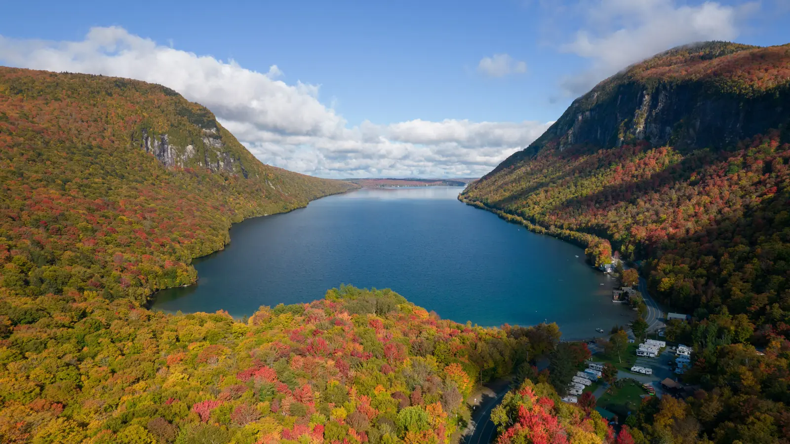 Lake Willoughby in the Northeast Kingdom of Vermont, between autumn-coloured hills.
